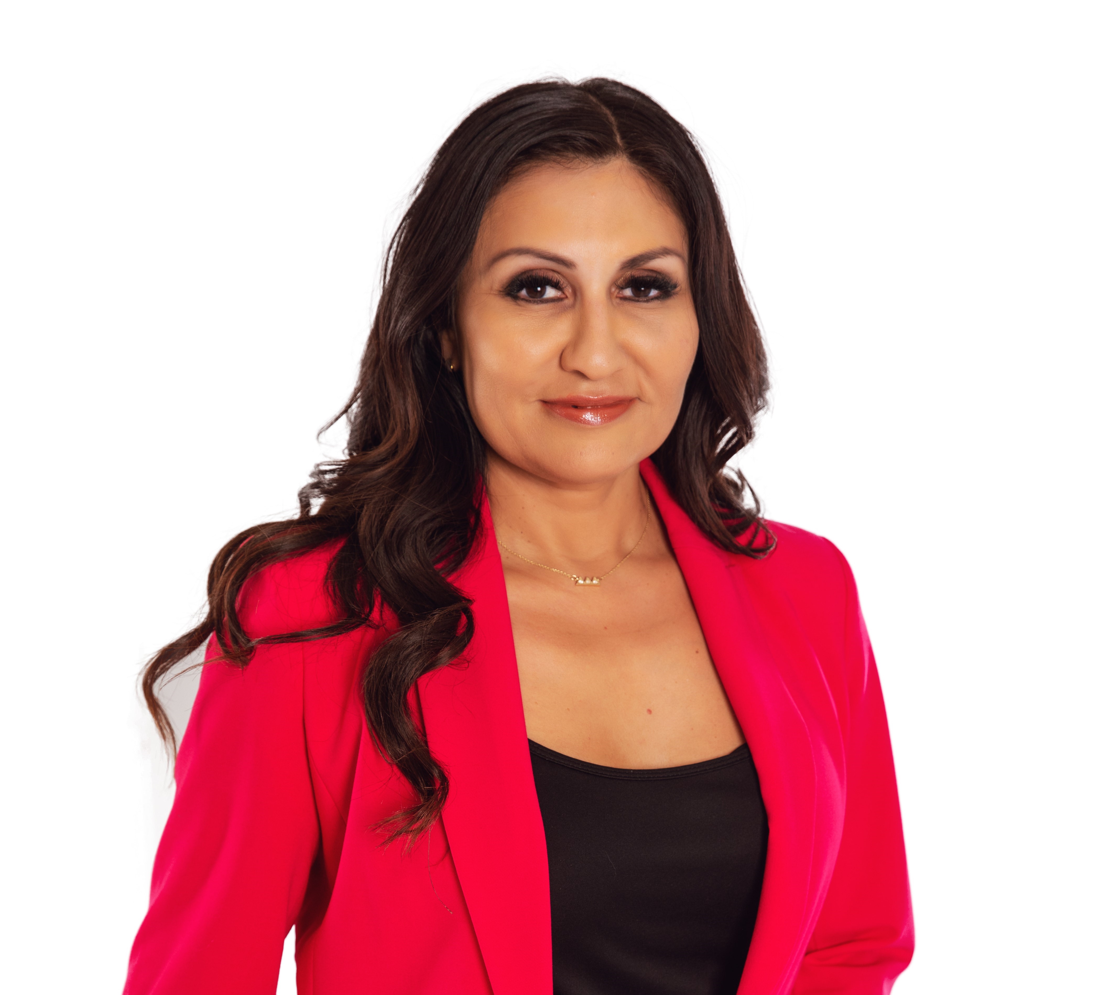 Women with long wavy brown hair smiling in a red suit